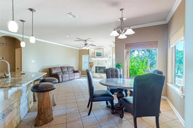 a spacious bathroom with a granite countertop tub sink and mirror