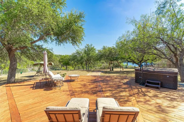 a view of a house with backyard and porch