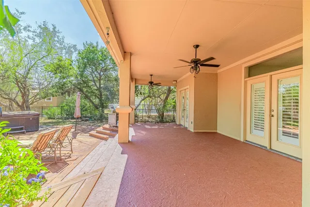 a view of a wooden deck with chairs
