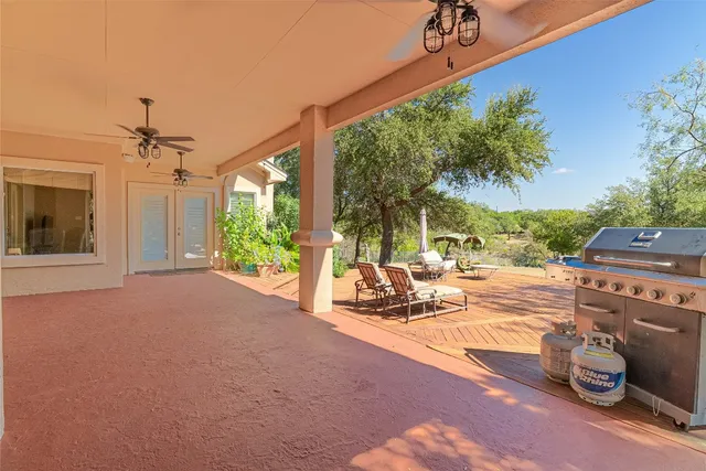 an aerial view of a houses with a yard