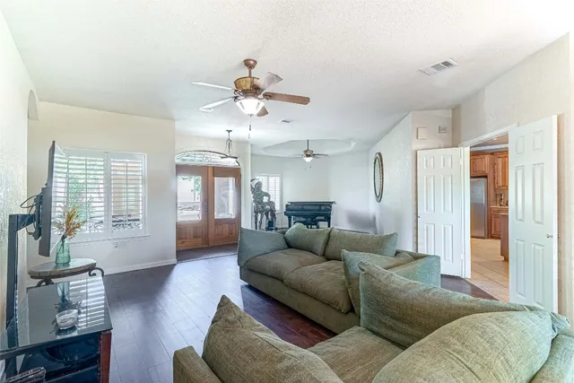 a living room with furniture window and wooden floor