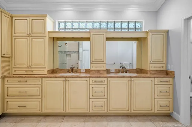 a bathroom with a glass shower door and a shower