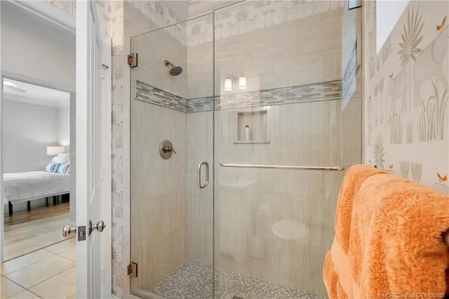 a kitchen with white cabinets and sink