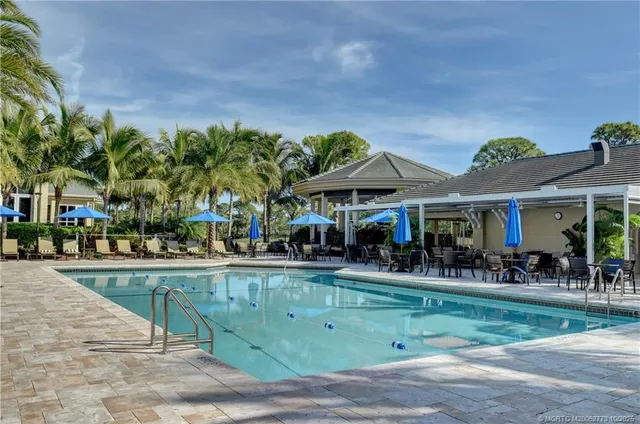 a view of a chairs and tables in the patio