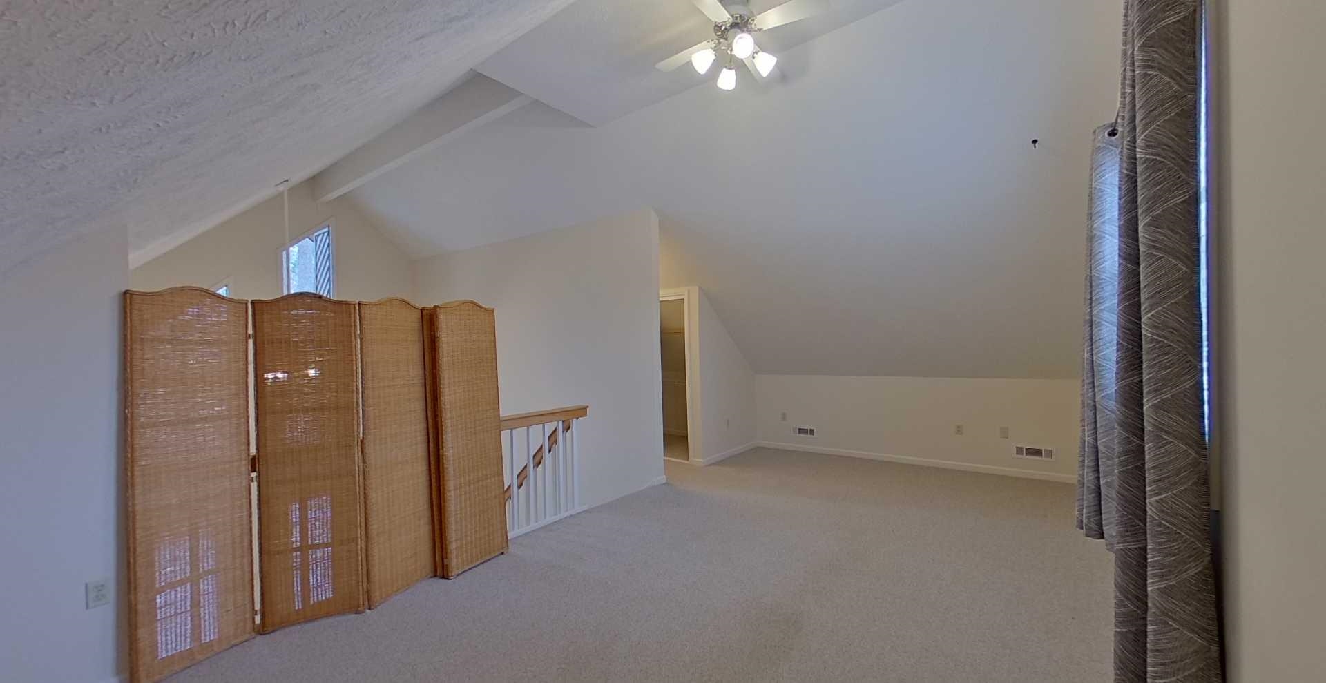54 Whispering Lane Counce, TN 38326 - Photo 22 of 35 an empty room with chandelier fan and hallway
