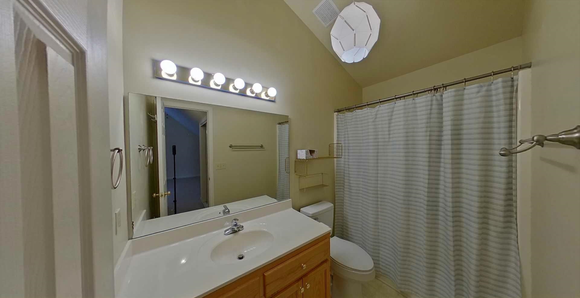 54 Whispering Lane Counce, TN 38326 - Photo 26 of 35 a bathroom with a sink a toilet and shower