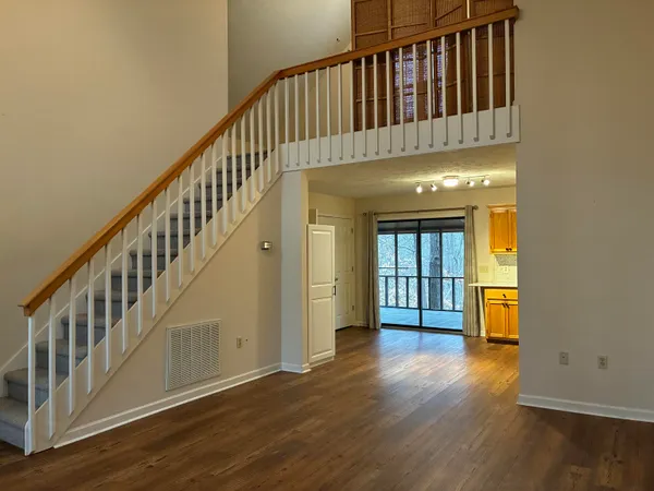 a view of an entryway with wooden floor