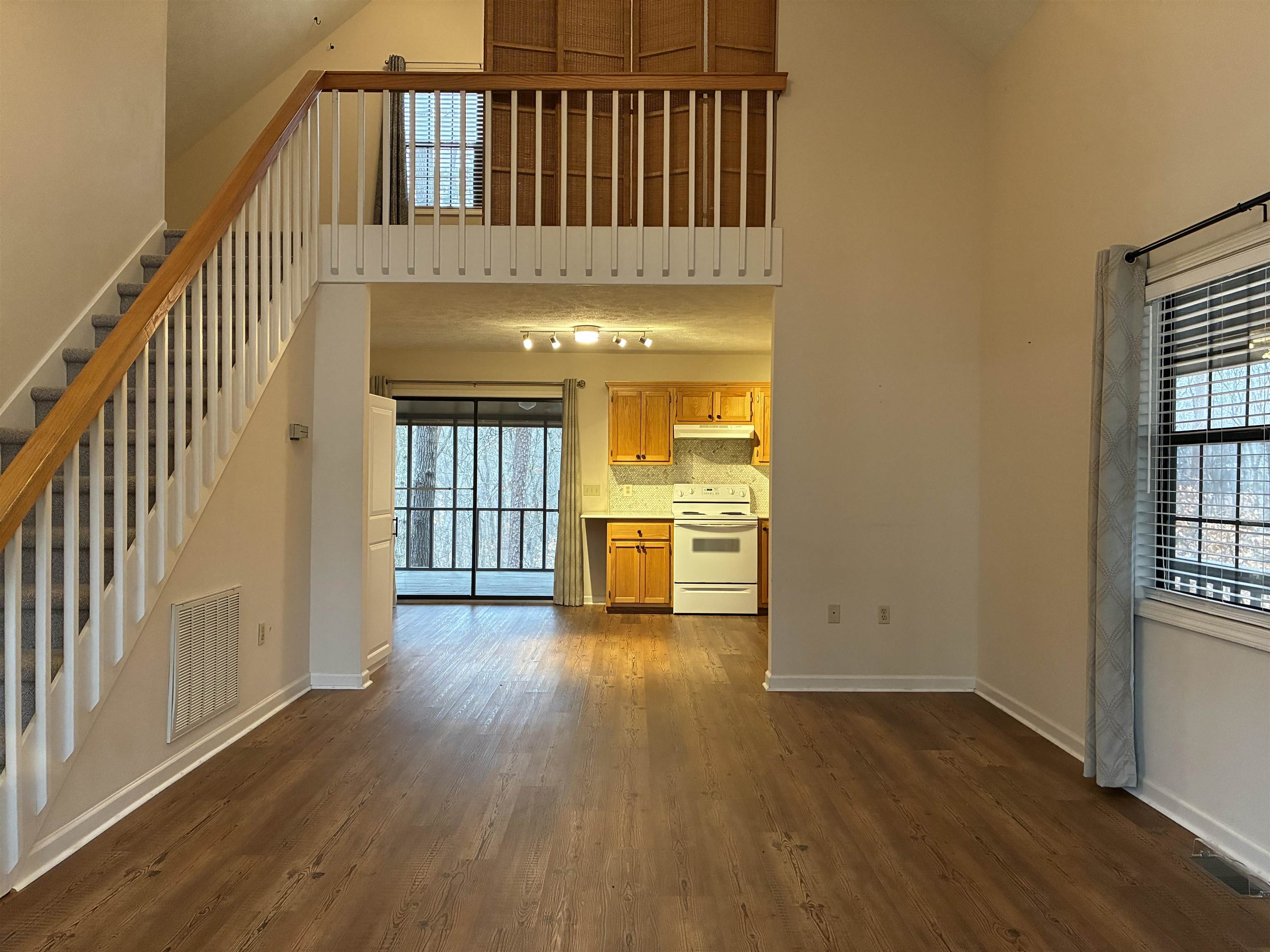 54 Whispering Lane Counce, TN 38326 - Photo 7 of 35 a view of a hallway with wooden floor and a bathroom