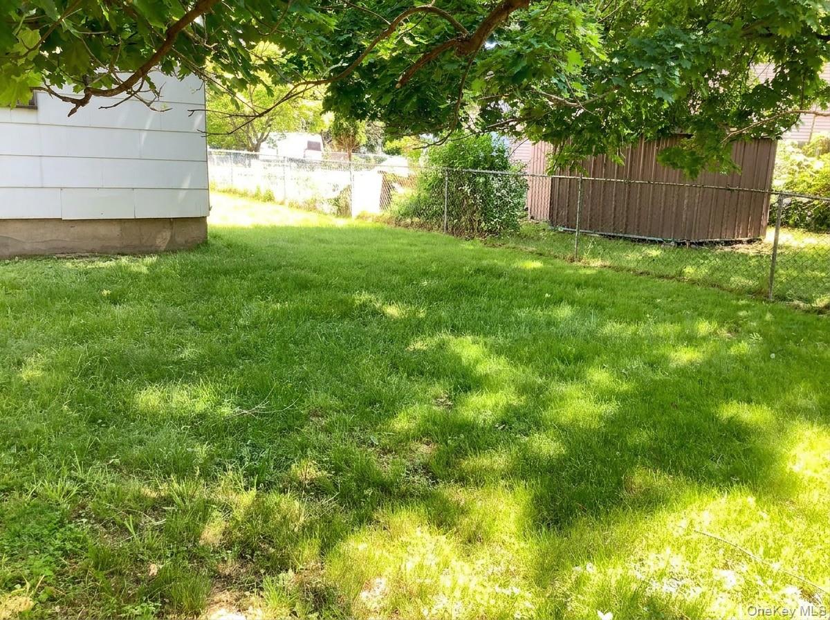 2 Sneden Court Spring Valley, NY 10977 - Photo 7 of 13 a view of backyard with tree