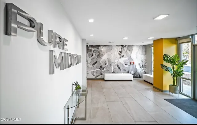 a view of a livingroom with furniture and a window