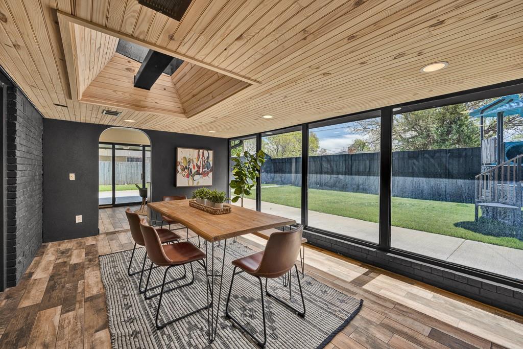 6117 Gainsborough Road Amarillo, TX 79106 - Photo 18 of 40 a view of a patio with a table chairs and wooden floor