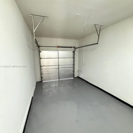 a view of a room with an empty walk in closet