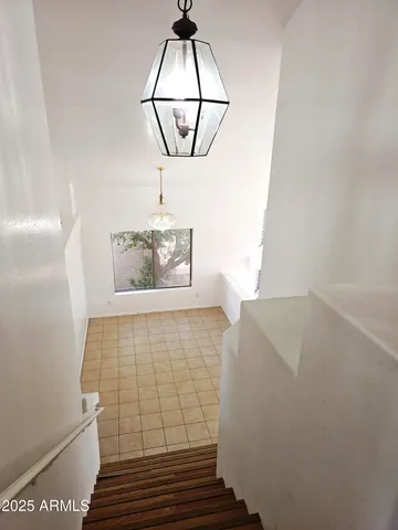 a bathroom with a bathtub shower sink and mirror