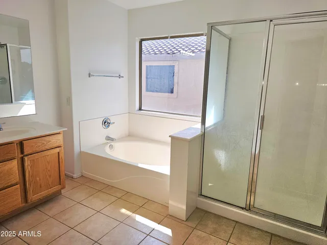 a utility room with cabinets washer and dryer
