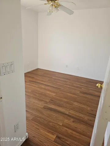 a white bench sitting in front of a building