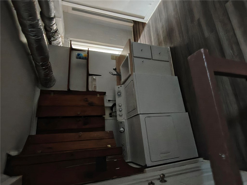 346 Clemson Street Clemson, SC 29631 - Photo 7 of 8 A dedicated laundry area features convenient stacked appliances and adjacent storage.