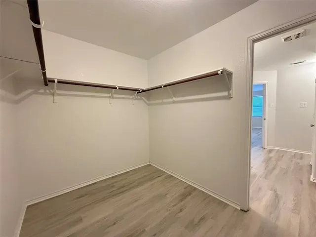a view of an empty walk in closet