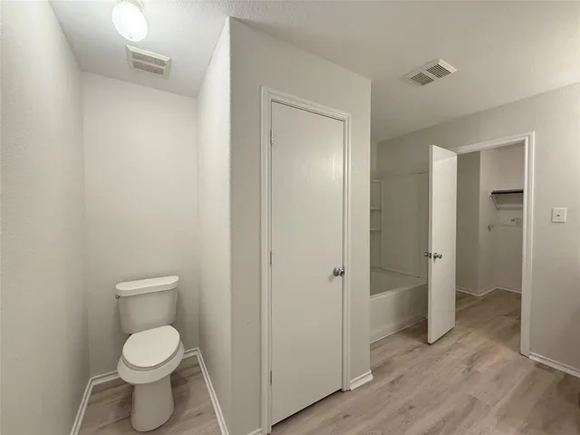 a bathroom with a toilet and a sink