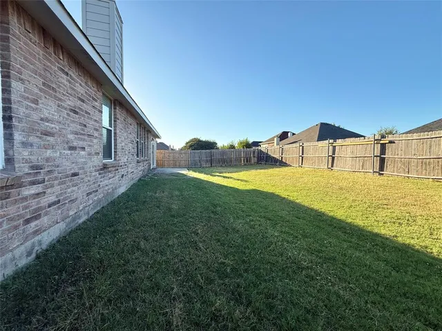 a house view with swimming pool in front of it