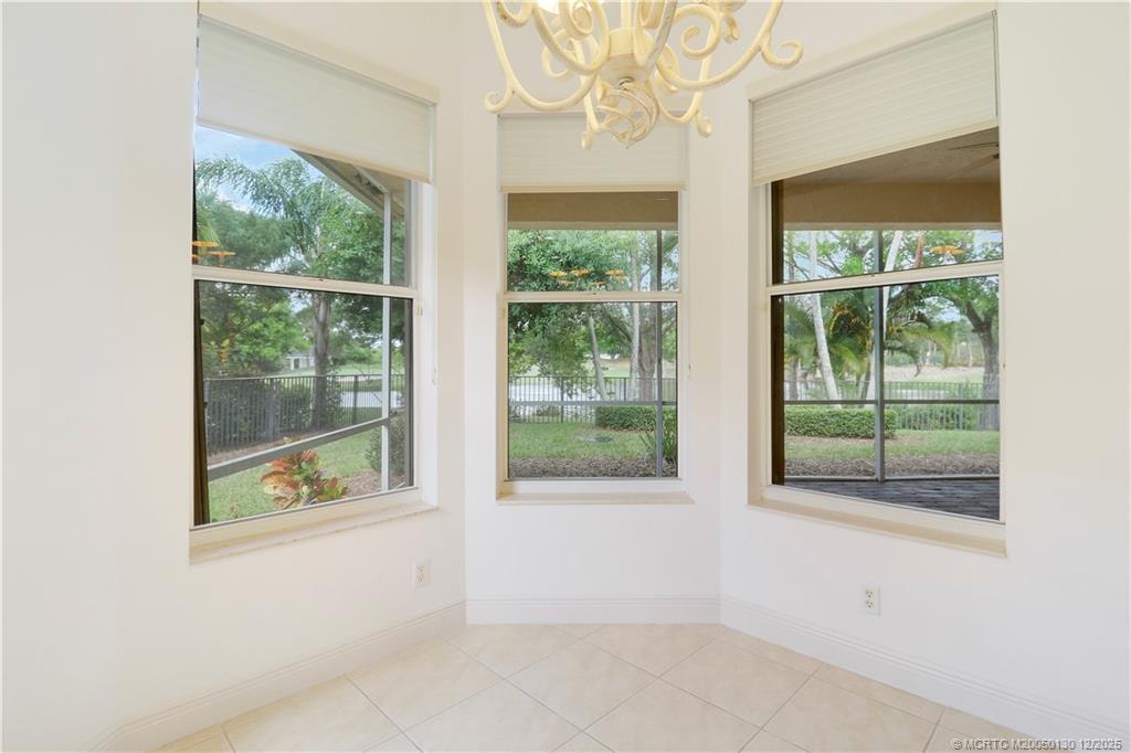 736 Southwest Pebble Lane Palm City, FL 34990 - Photo 19 of 54 an empty room with windows