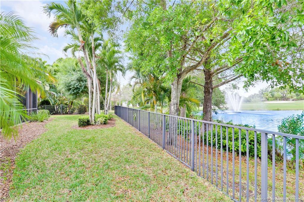 736 Southwest Pebble Lane Palm City, FL 34990 - Photo 42 of 54 a view of backyard with trees