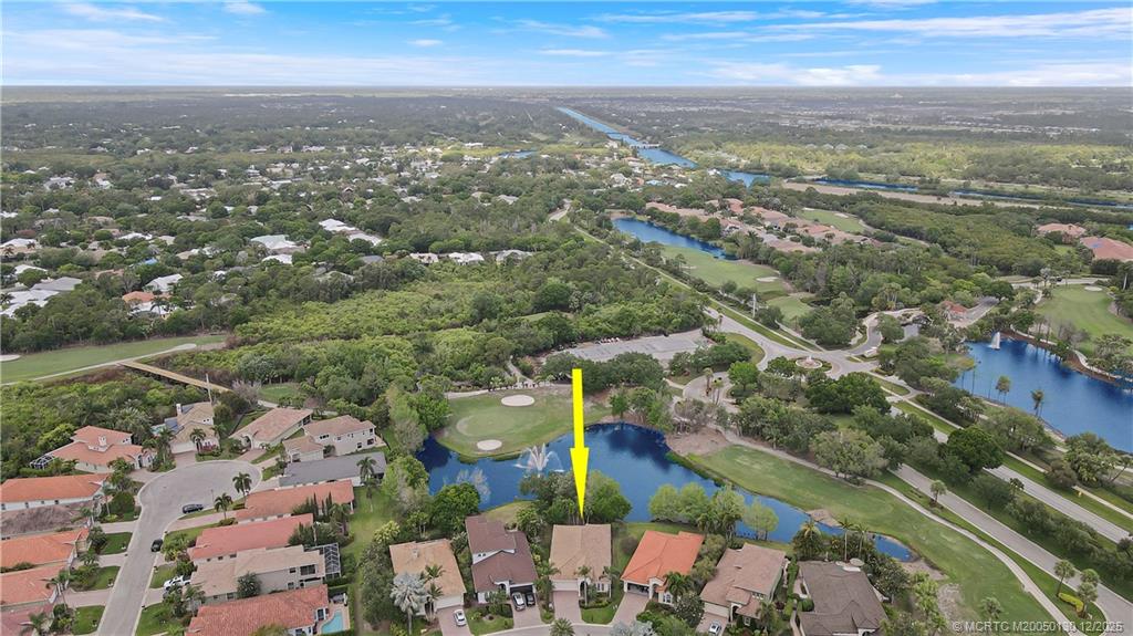 736 Southwest Pebble Lane Palm City, FL 34990 - Photo 47 of 54 an aerial view of city and lake