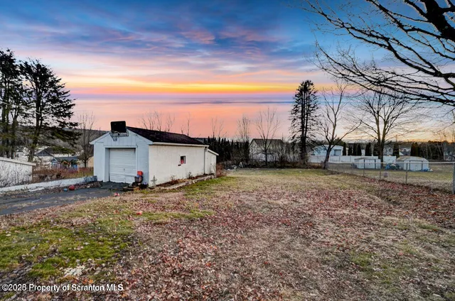 a house view with a backyard space