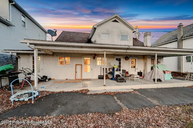 a view of a chairs and table in a patio