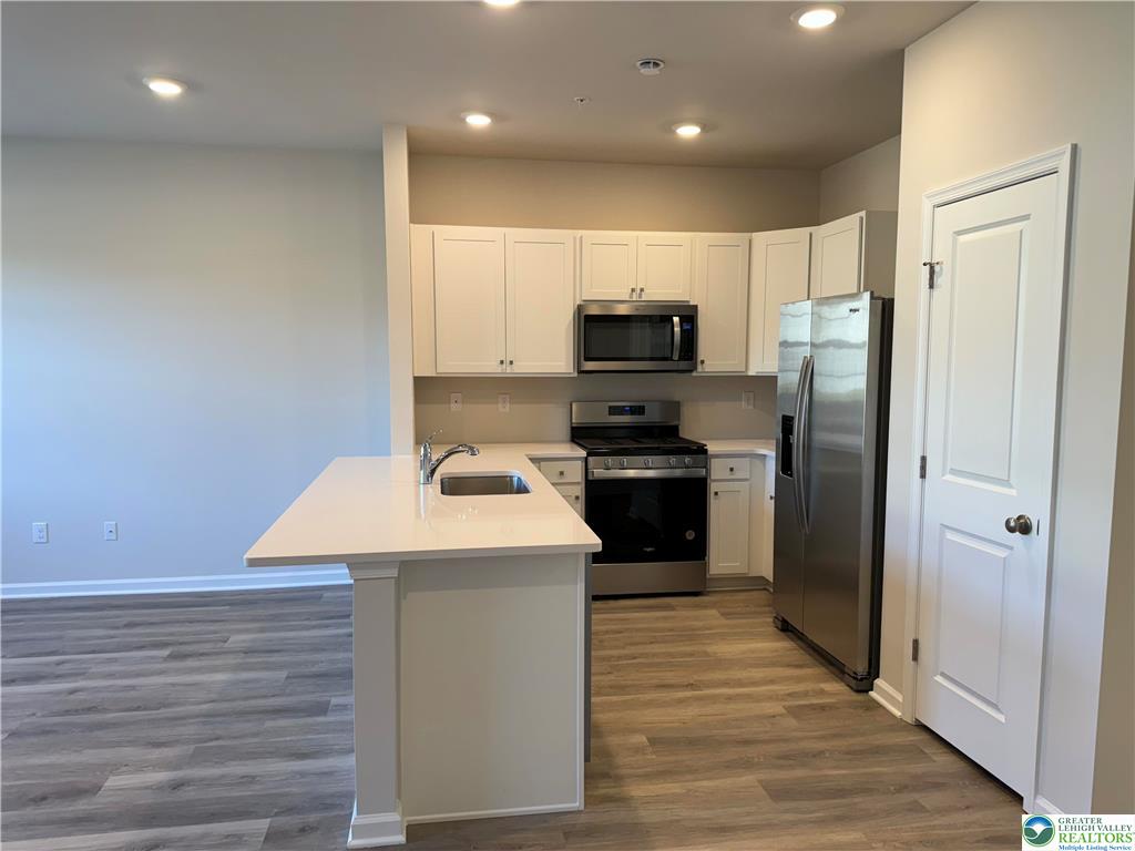 1145 Martin Road Breinigsville, PA 18031 - Photo 35 of 38 A well-appointed kitchen features stainless steel appliances and an inviting island with sink.