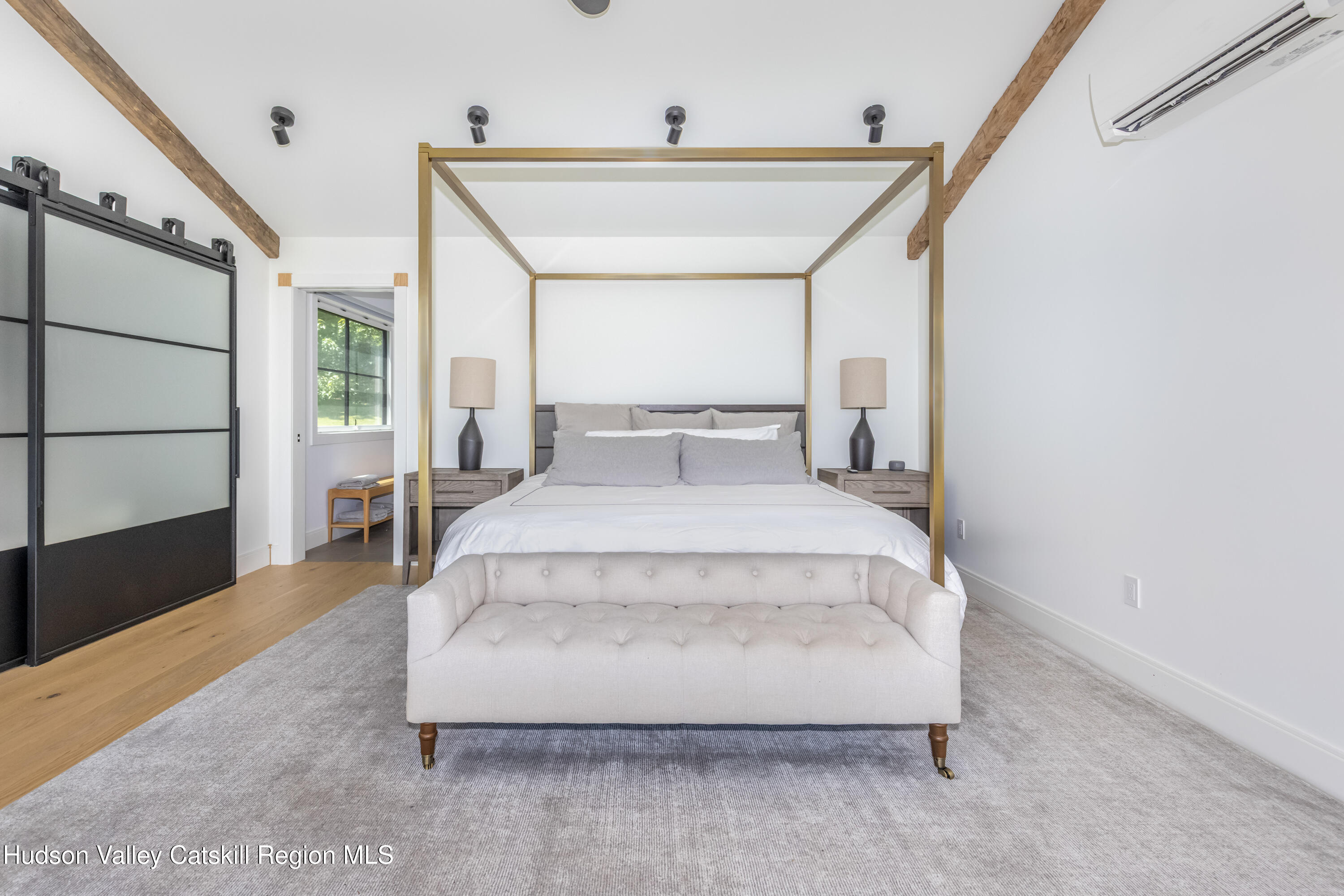 688 Bruce Porn Road Gilboa, NY 12167 - Photo 62 of 104 a spacious bedroom with a bed and a window