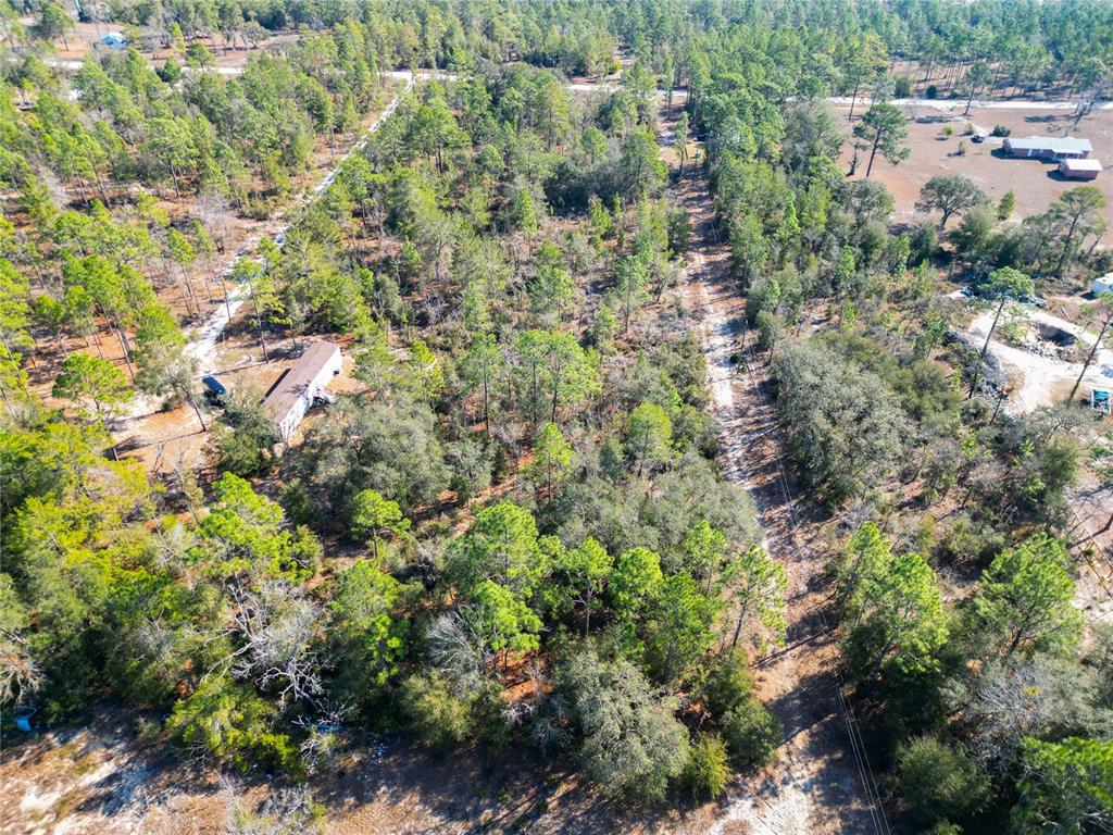 Tbd Northeast 58th Street Bronson, FL 32621 - Photo 11 of 22 an aerial view of residential house with outdoor space and trees all around