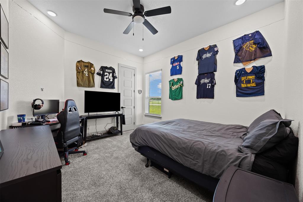6317 Vega Road Godley, TX 76044 - Photo 20 of 27 a bedroom with a bed and furniture