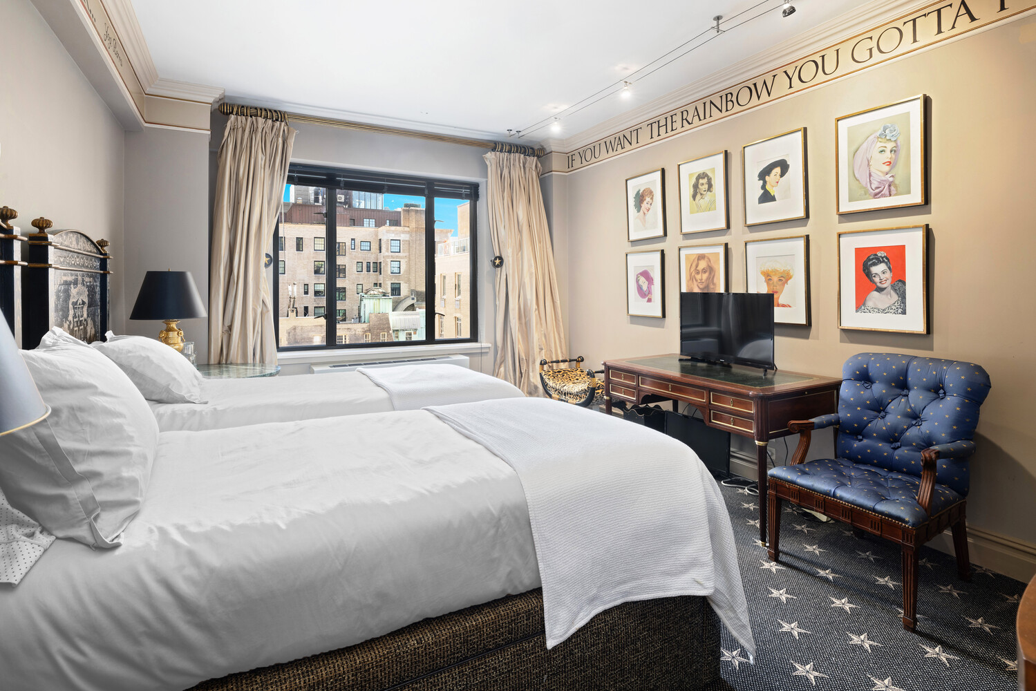 870 5th Avenue, Unit 11A Manhattan, NY 10065 - Photo 9 of 13 a bedroom with a bed a couch and a window