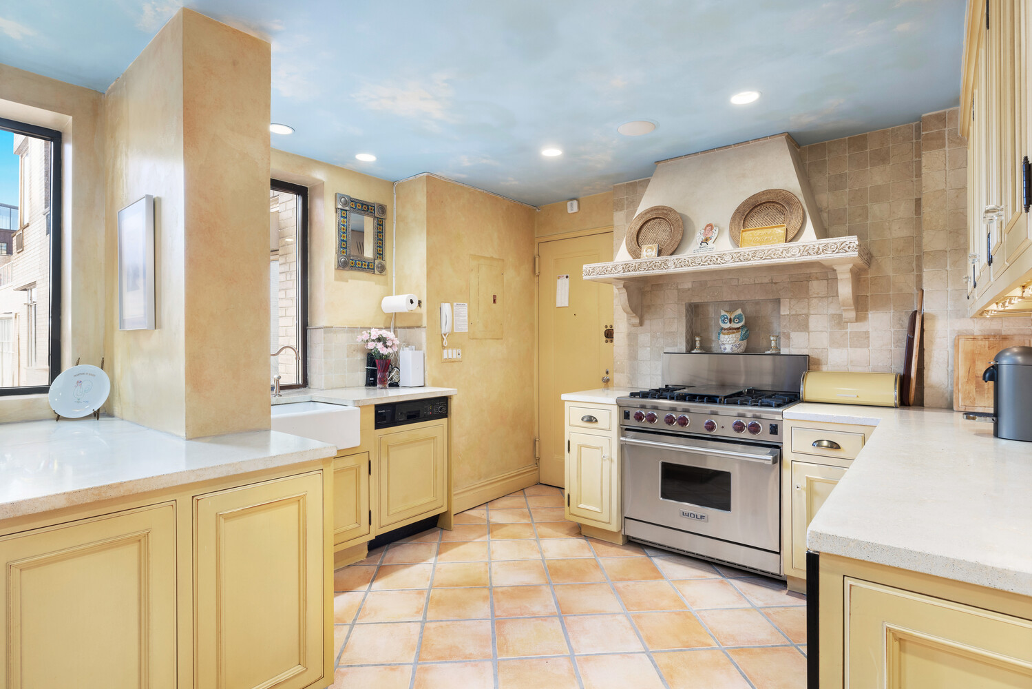870 5th Avenue, Unit 11A Manhattan, NY 10065 - Photo 5 of 13 a kitchen with cabinets and a stove top oven