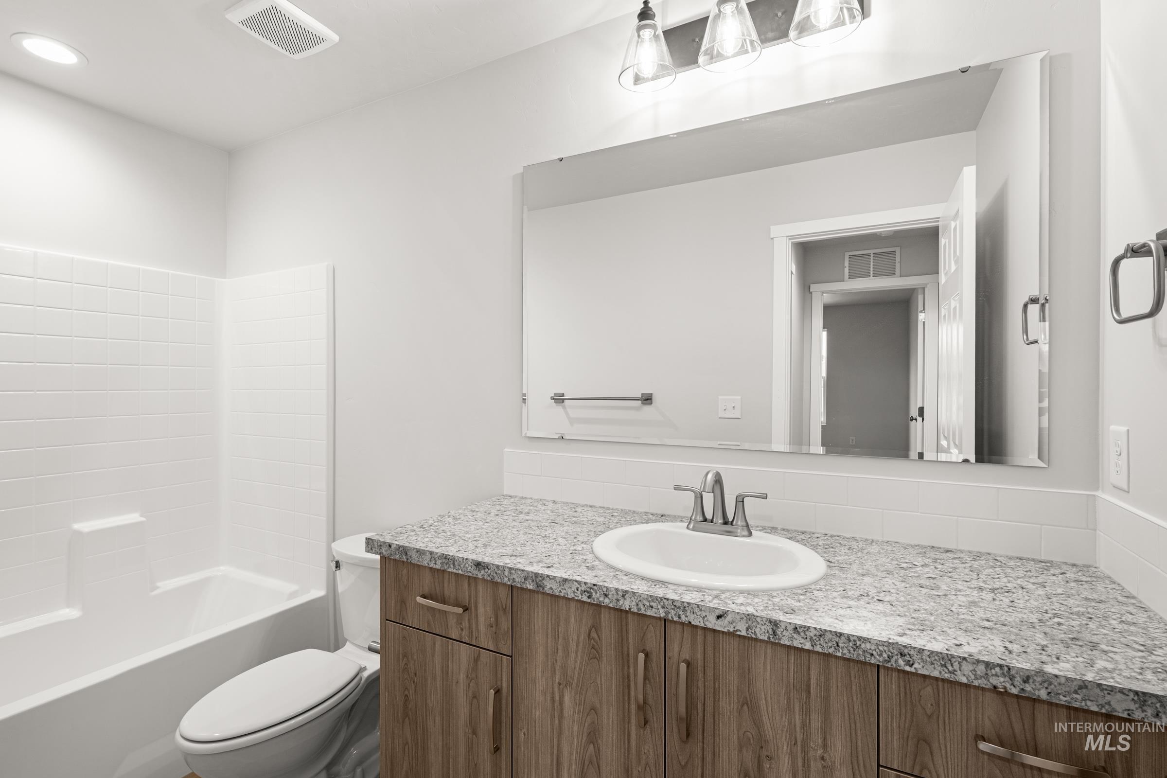 13693 Redway Court Caldwell, ID 83607 - Photo 24 of 25 Bathroom featuring vanity and shower combination
