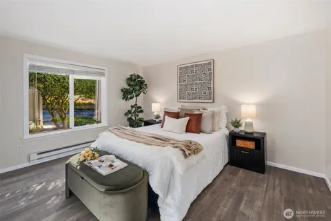 a bathroom with a sink mirror vanity and toilet