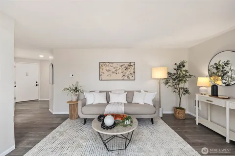 a kitchen with a sink appliances and cabinets