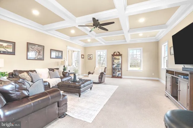a living room with fireplace furniture and a flat screen tv