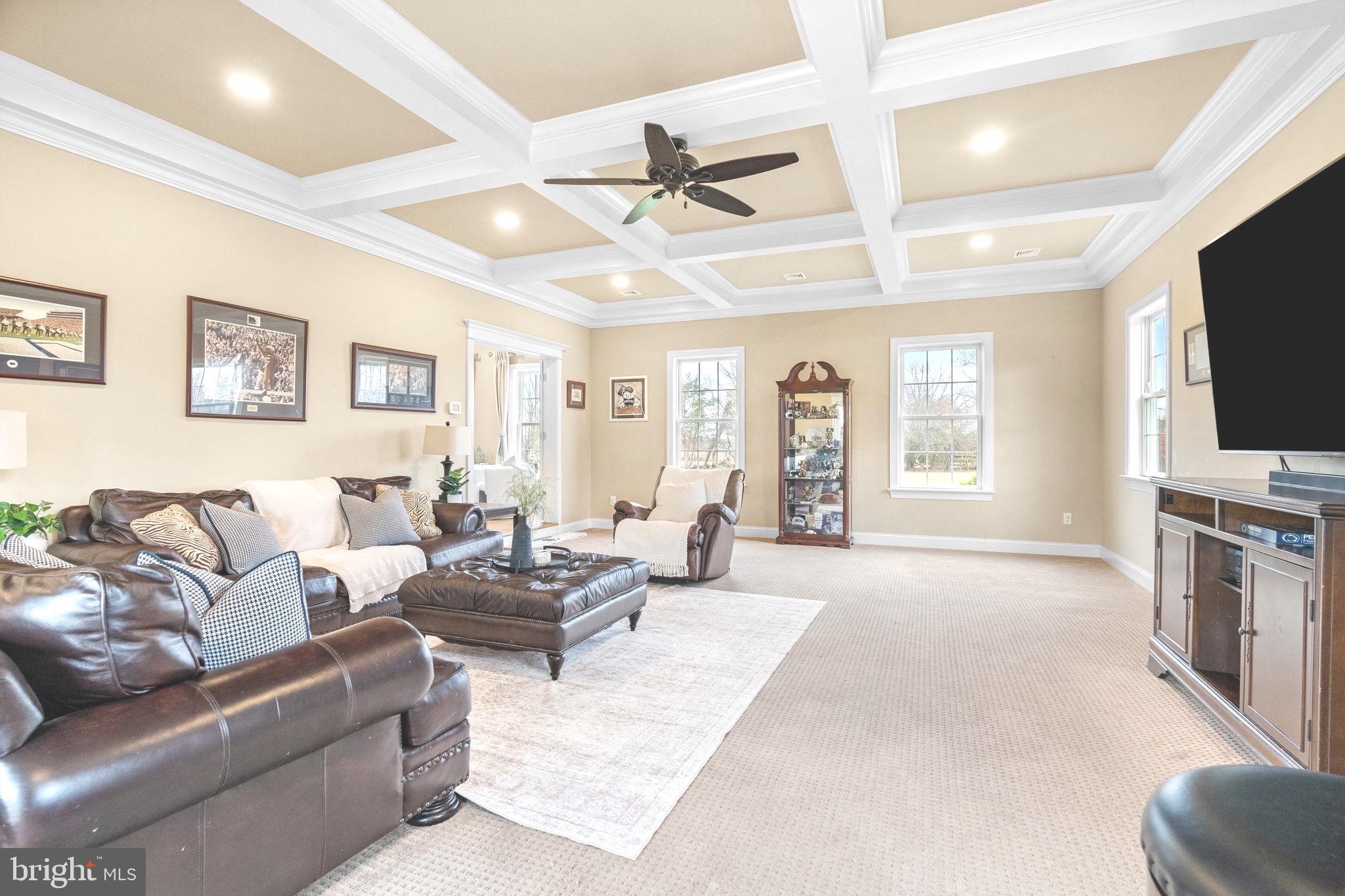 3320 Fisher Road Lansdale, PA 19446 - Photo 17 of 65 a living room with furniture a flat screen tv and a window