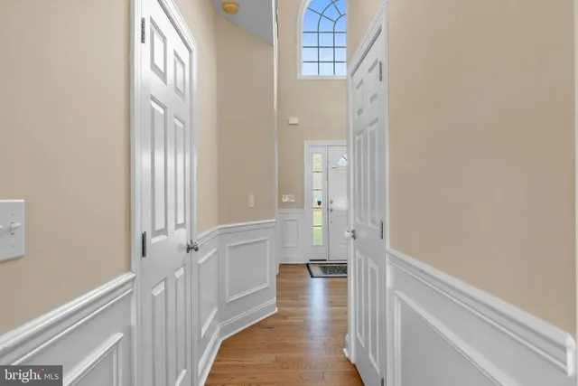 a spacious bedroom with a bed and a mirror