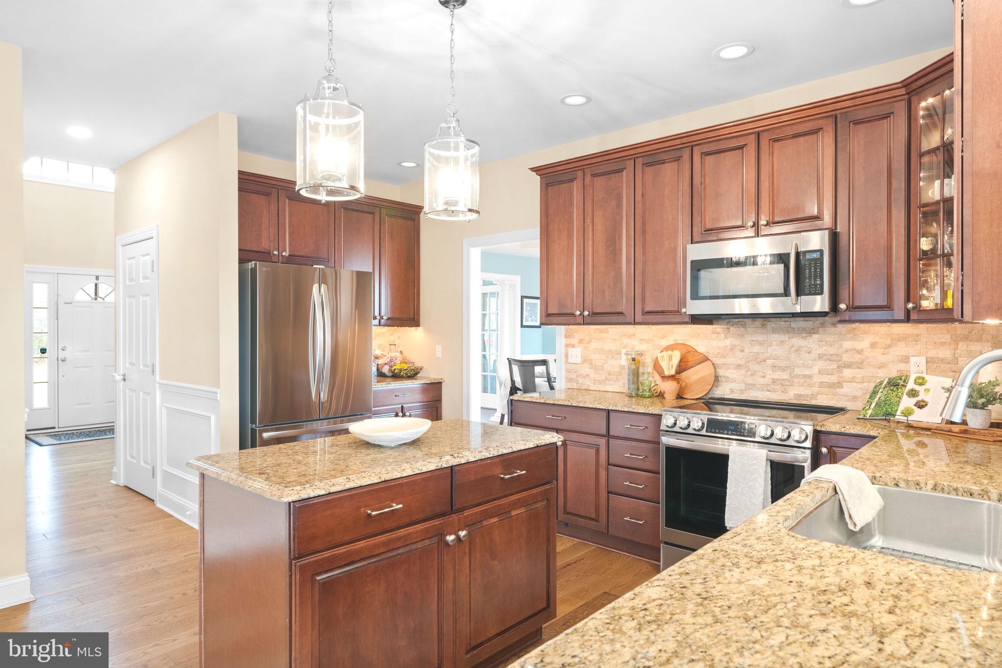3320 Fisher Road Lansdale, PA 19446 - Photo 28 of 65 a kitchen with stainless steel appliances granite countertop a sink stove and refrigerator