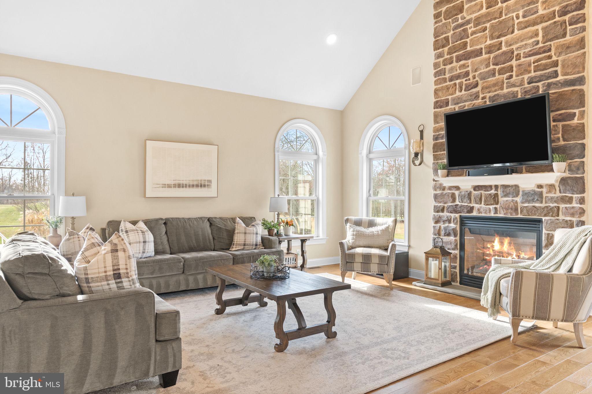 3320 Fisher Road Lansdale, PA 19446 - Photo 31 of 65 a living room with furniture fireplace and flat screen tv