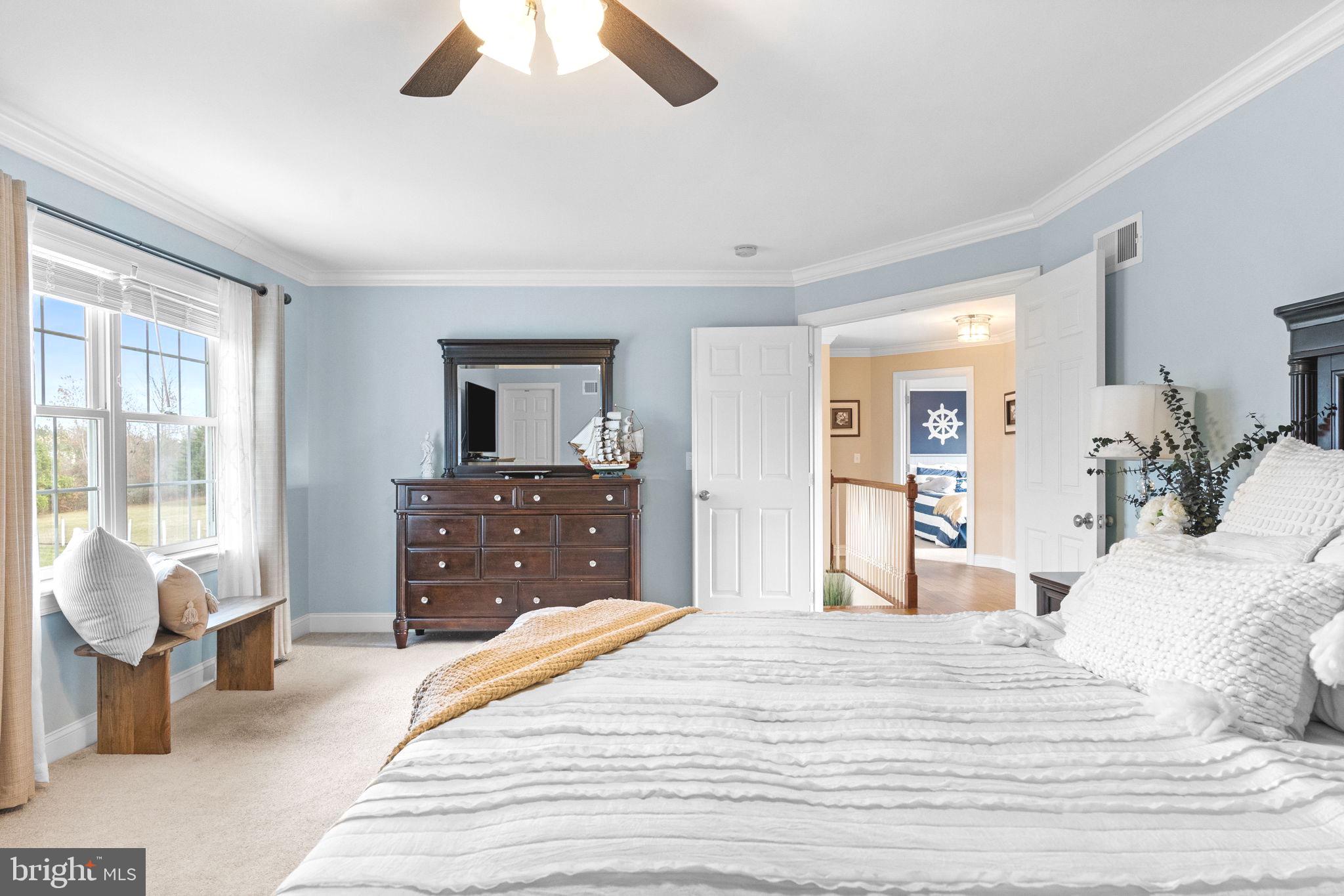 3320 Fisher Road Lansdale, PA 19446 - Photo 39 of 65 a bedroom with a large bed and a chandelier