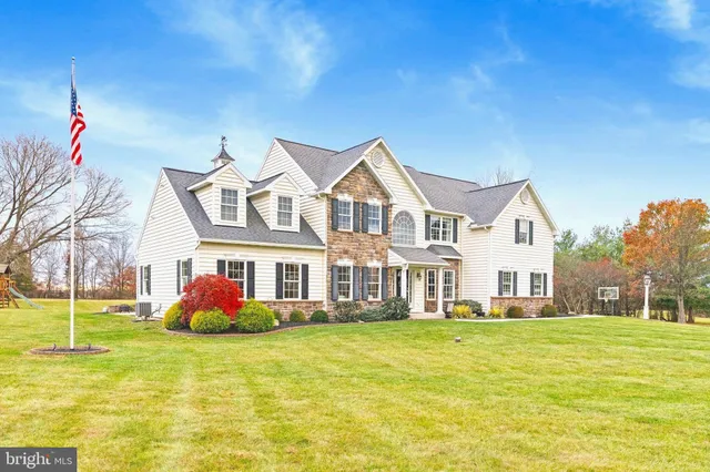 a view of a livingroom with furniture and a flat screen tv