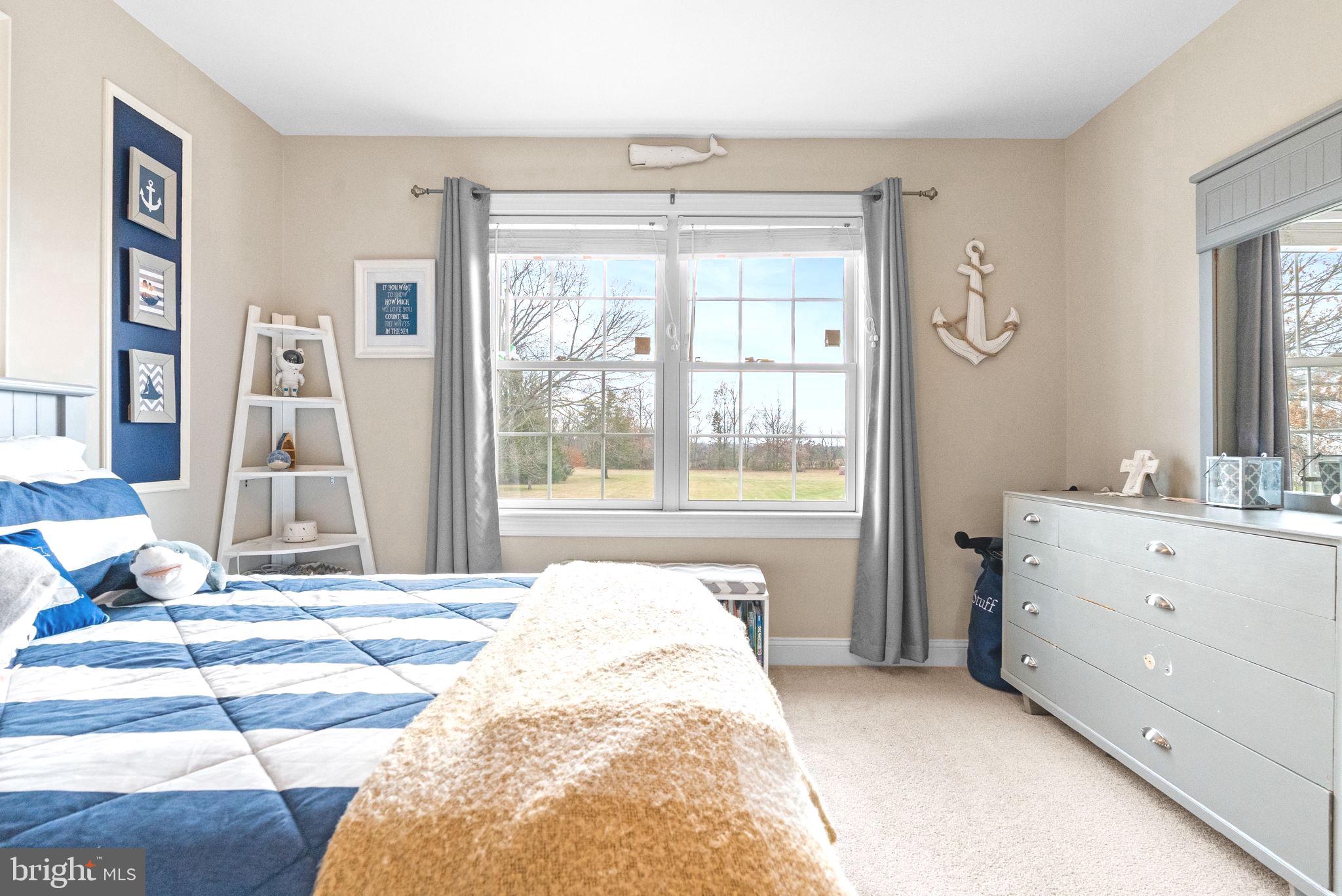 3320 Fisher Road Lansdale, PA 19446 - Photo 47 of 65 a spacious bedroom with a bed and a mirror