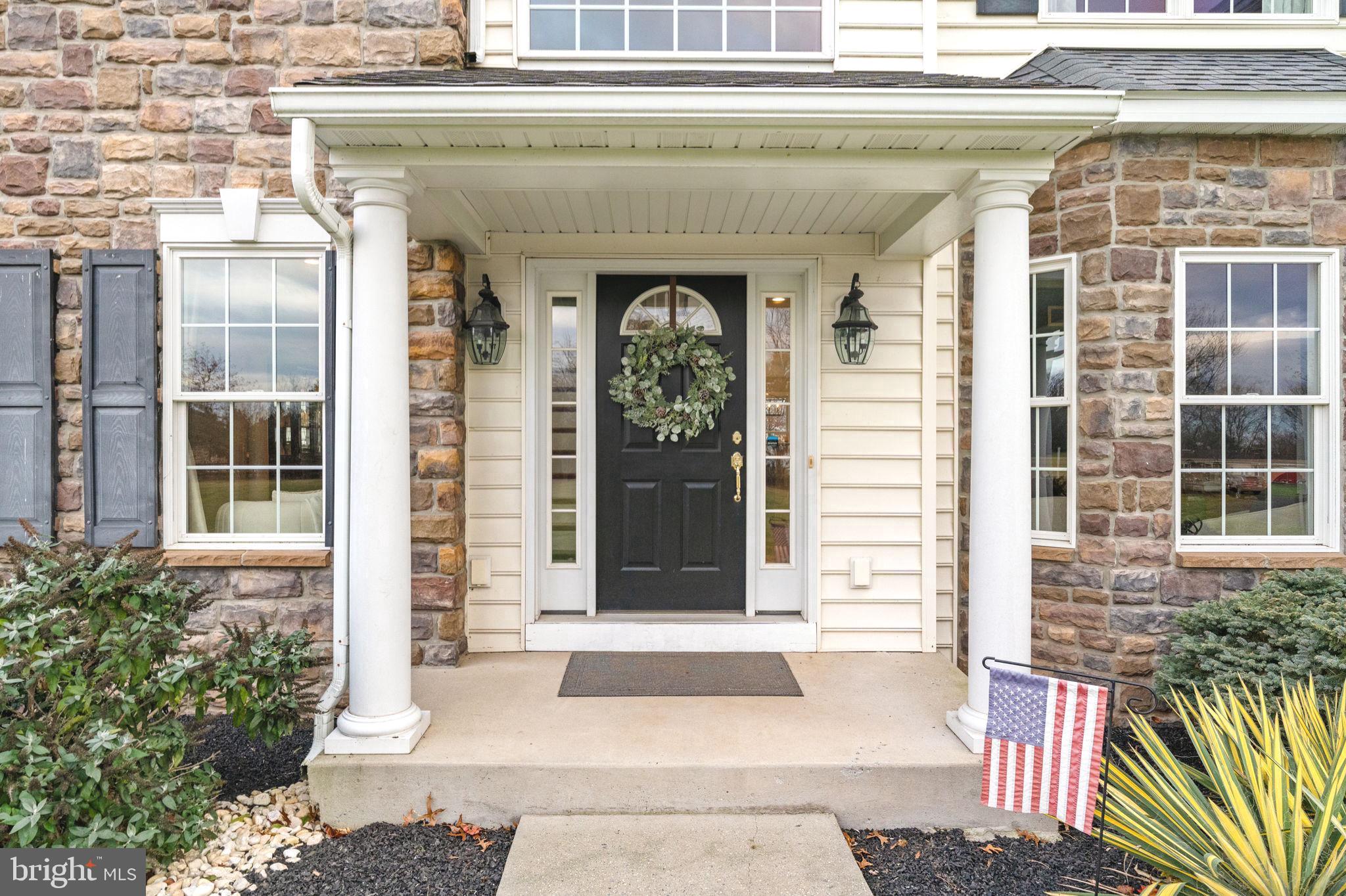 3320 Fisher Road Lansdale, PA 19446 - Photo 5 of 65 a front view of a house with a garden