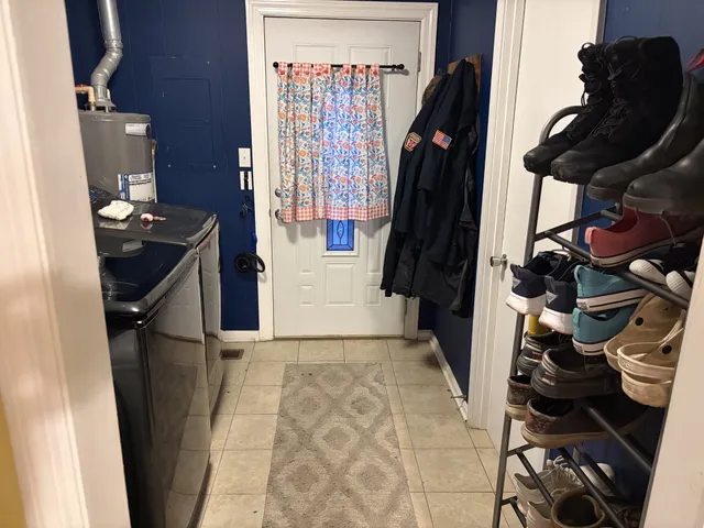 a bathroom with a toilet and shower