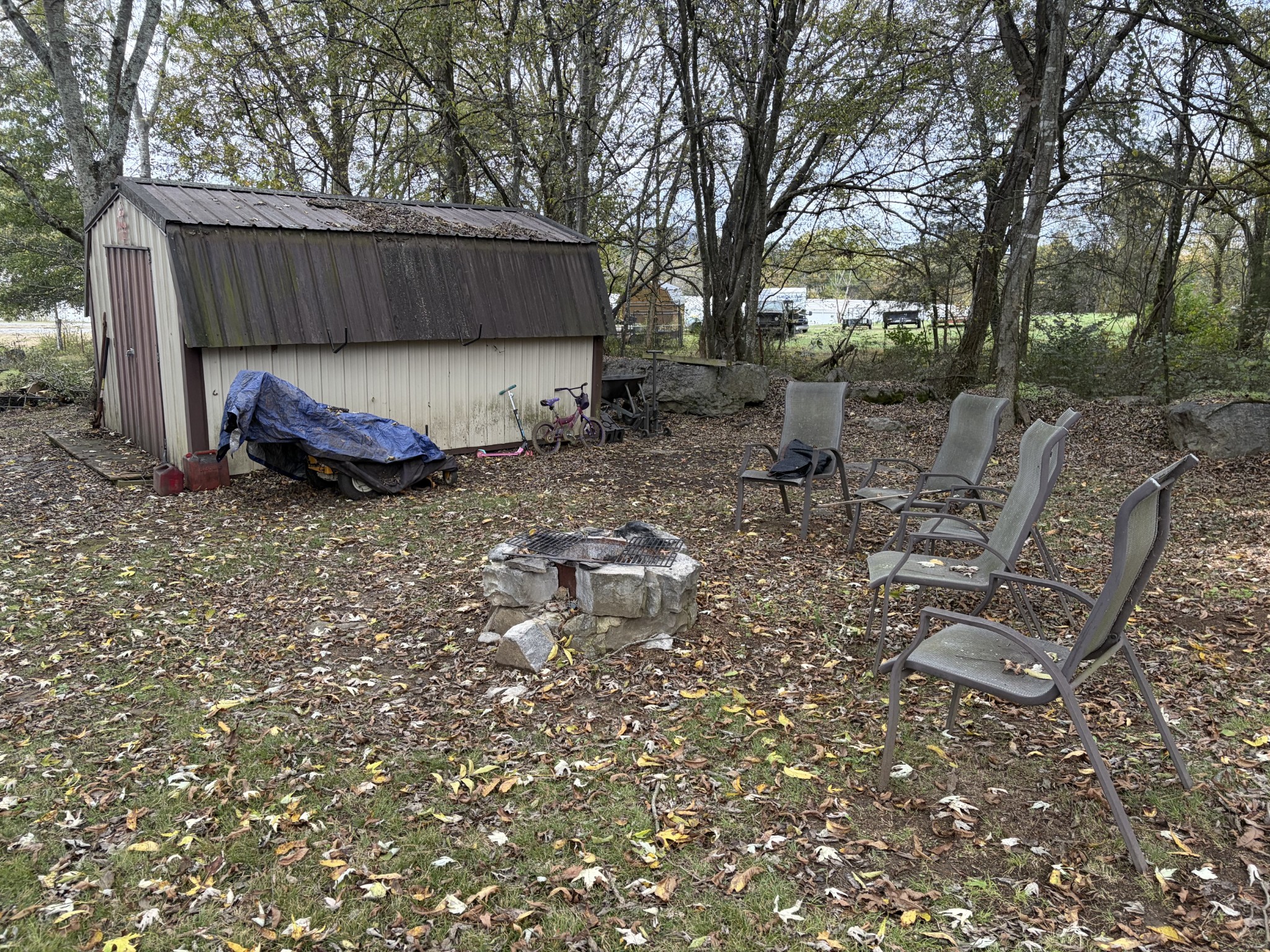 263 Hogan Road Gordonsville, TN 38563 - Photo 14 of 22 a view of backyard with wooden fence and a large tree