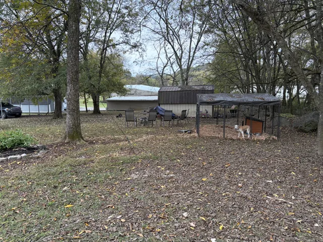 a view of a house with a yard and garage