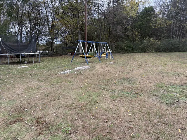 a view of a park with swings